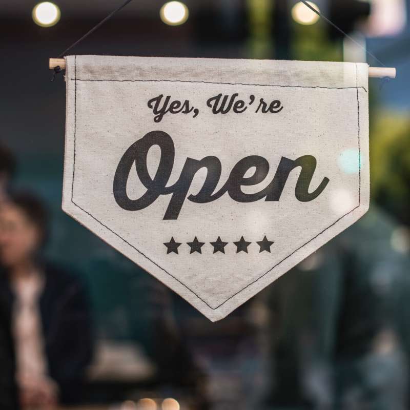 open sign in a store front